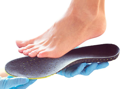 Patient being fitted for custom orthotics at Kalamazoo Foot Surgery